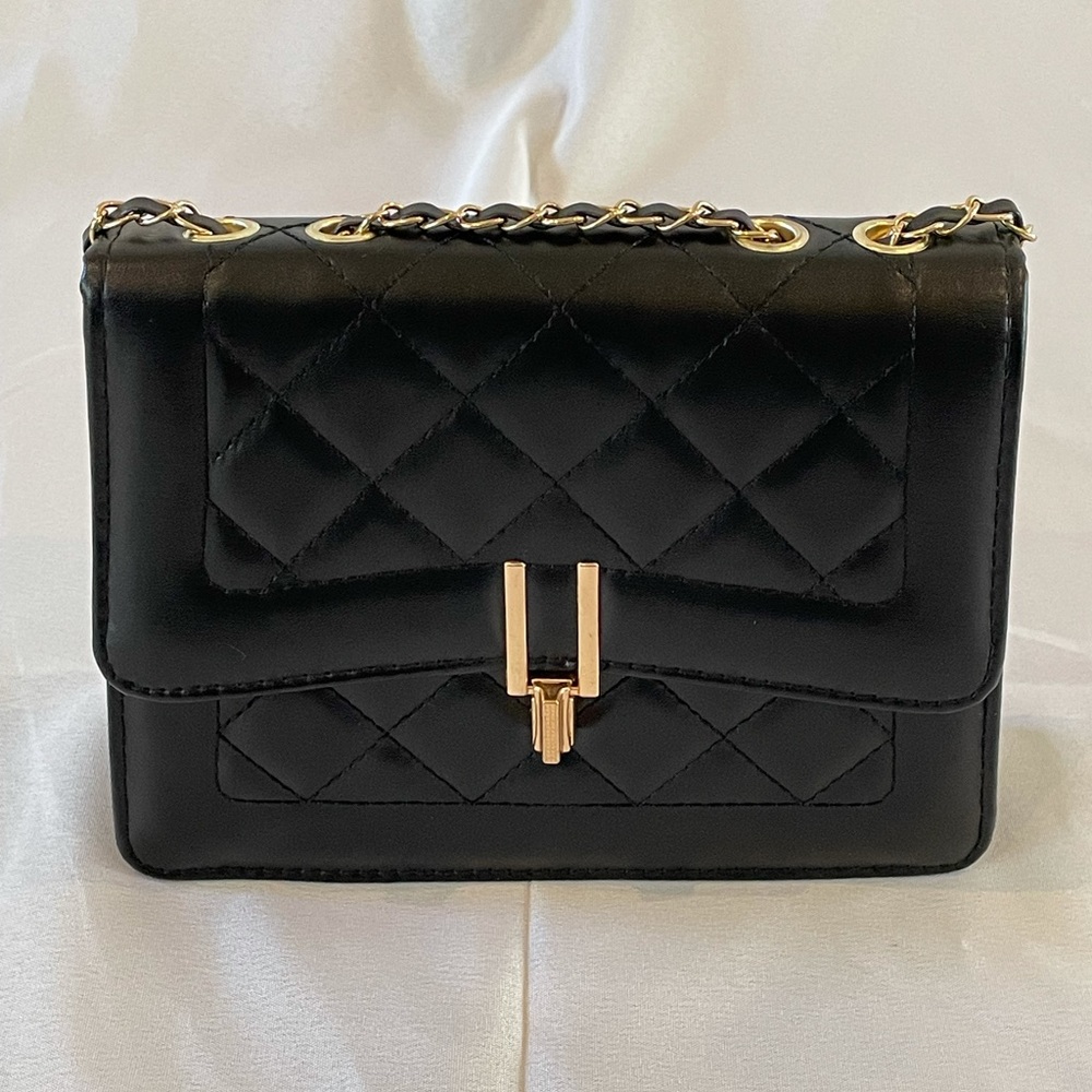 Small leather handbag with adjustable strap